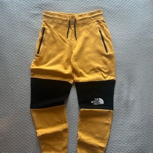 The North Face Yellow and Black Joggers